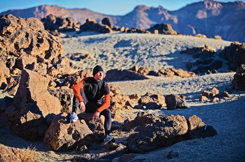 Stig Severinsen Sitting in a Beautiful Mountain Terrain