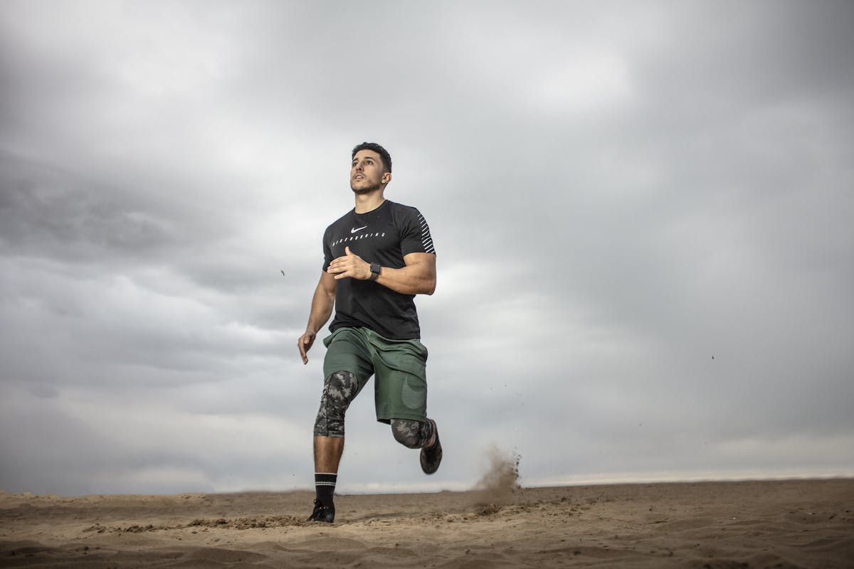 Man Running on a Sand Field